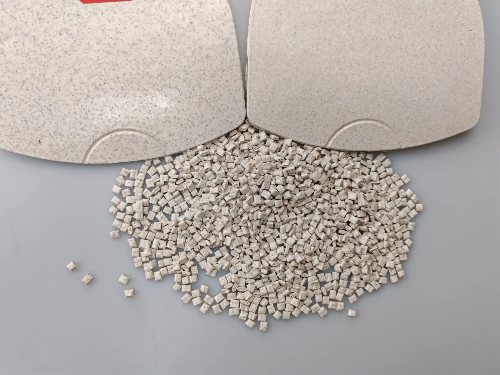 Grain-fiber and wheat-straw PP pellets with molded comparison plaques