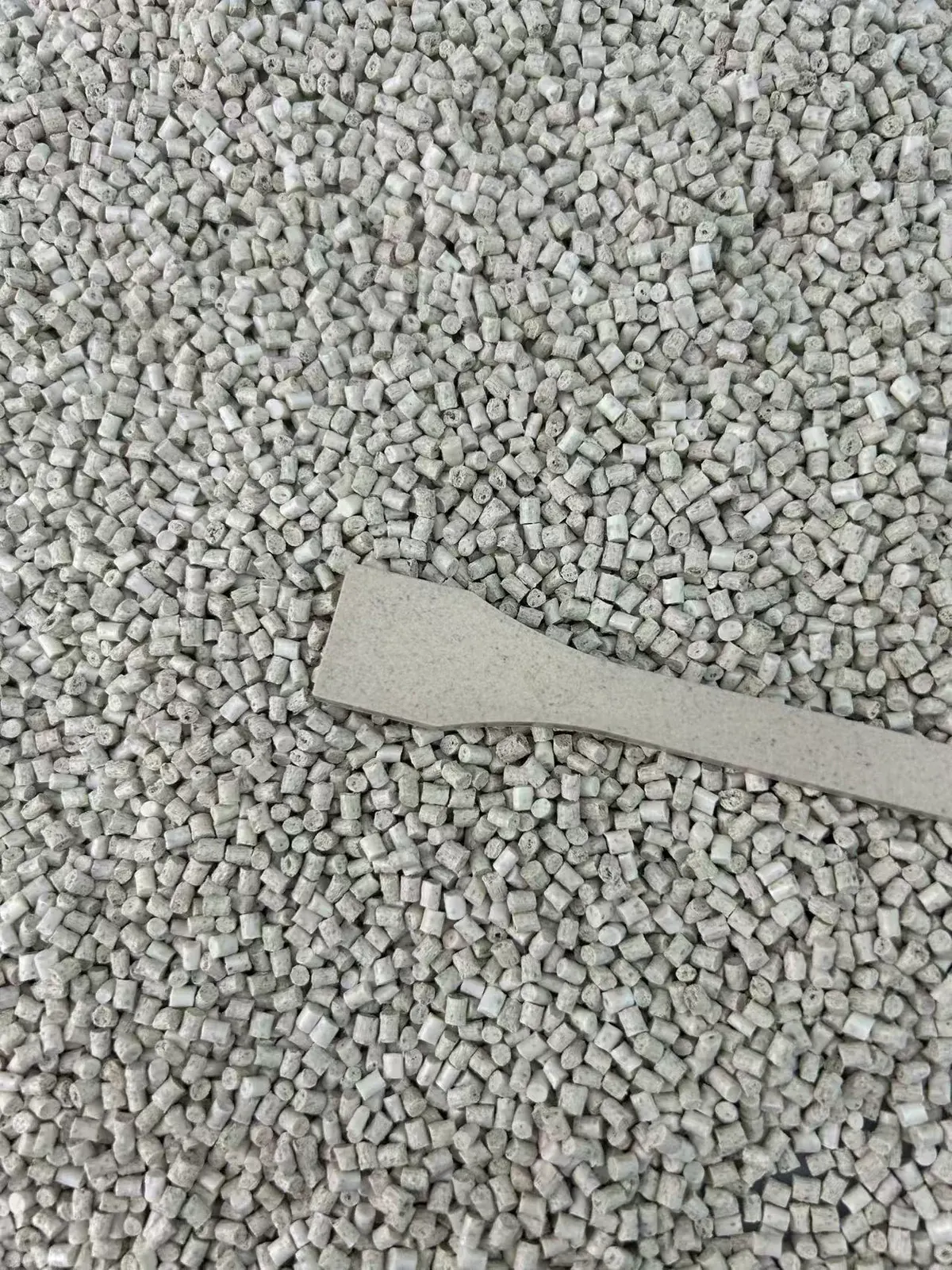 Cereal fiber ABS pellets with a molded test strip